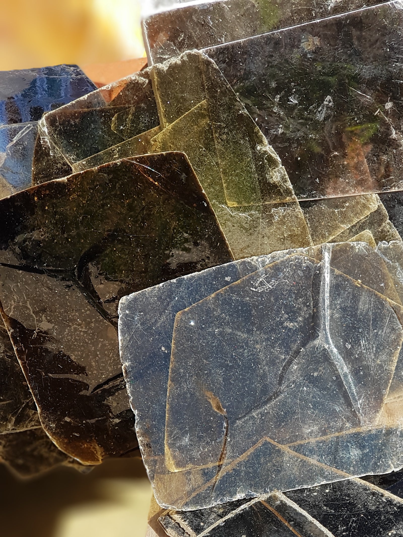 multiple sheets of biotite. the sheets are thin and  very translucent. The biotite is a very dark brown. 