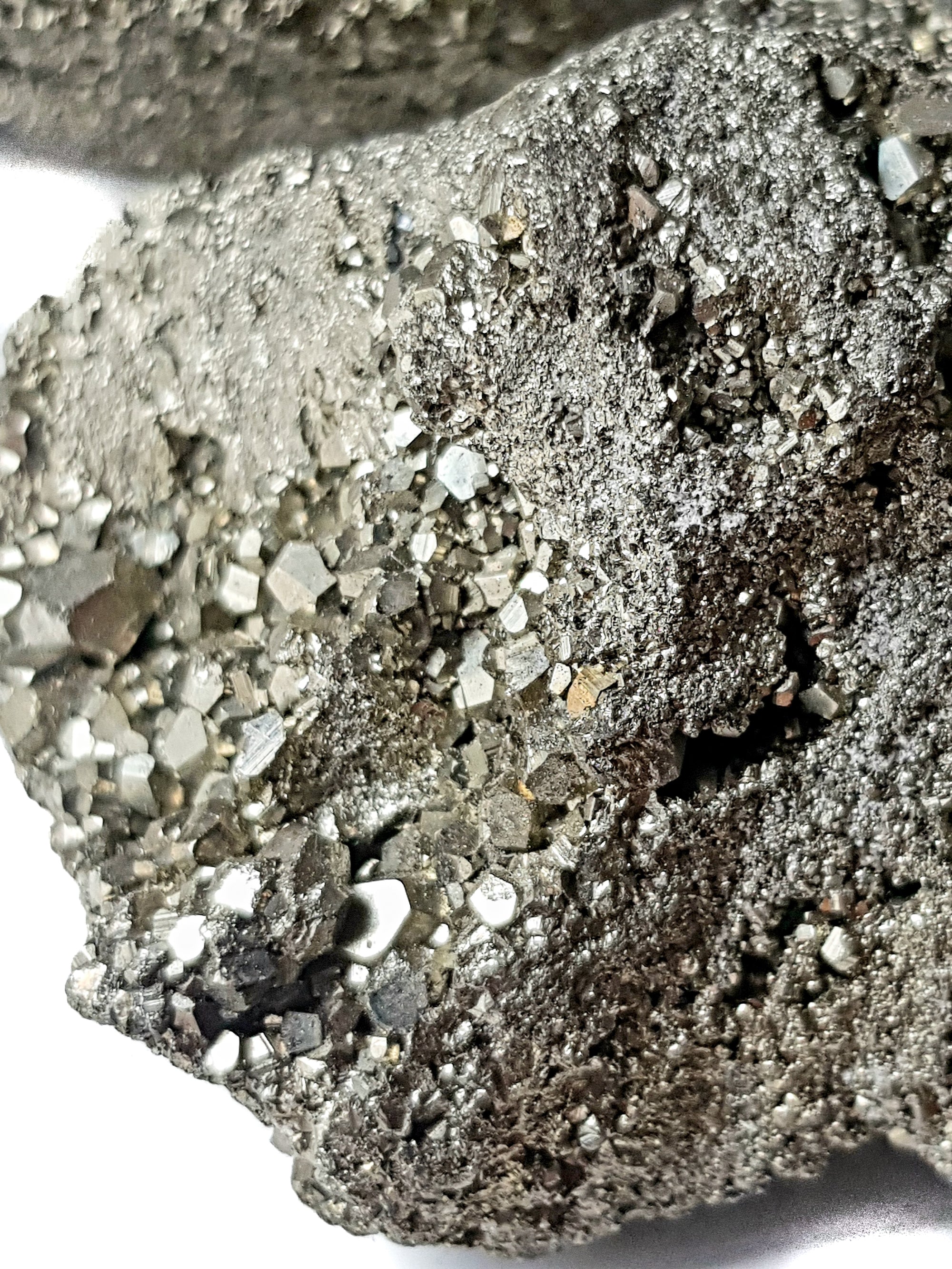 A close up of a chunk of pyrite showing multiple dodecahedral crystals
