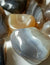 close up of two pieces of banded botswana agate. The pieces are translucent and vary in colour. Banding alternates between shades of orange, white and grey.