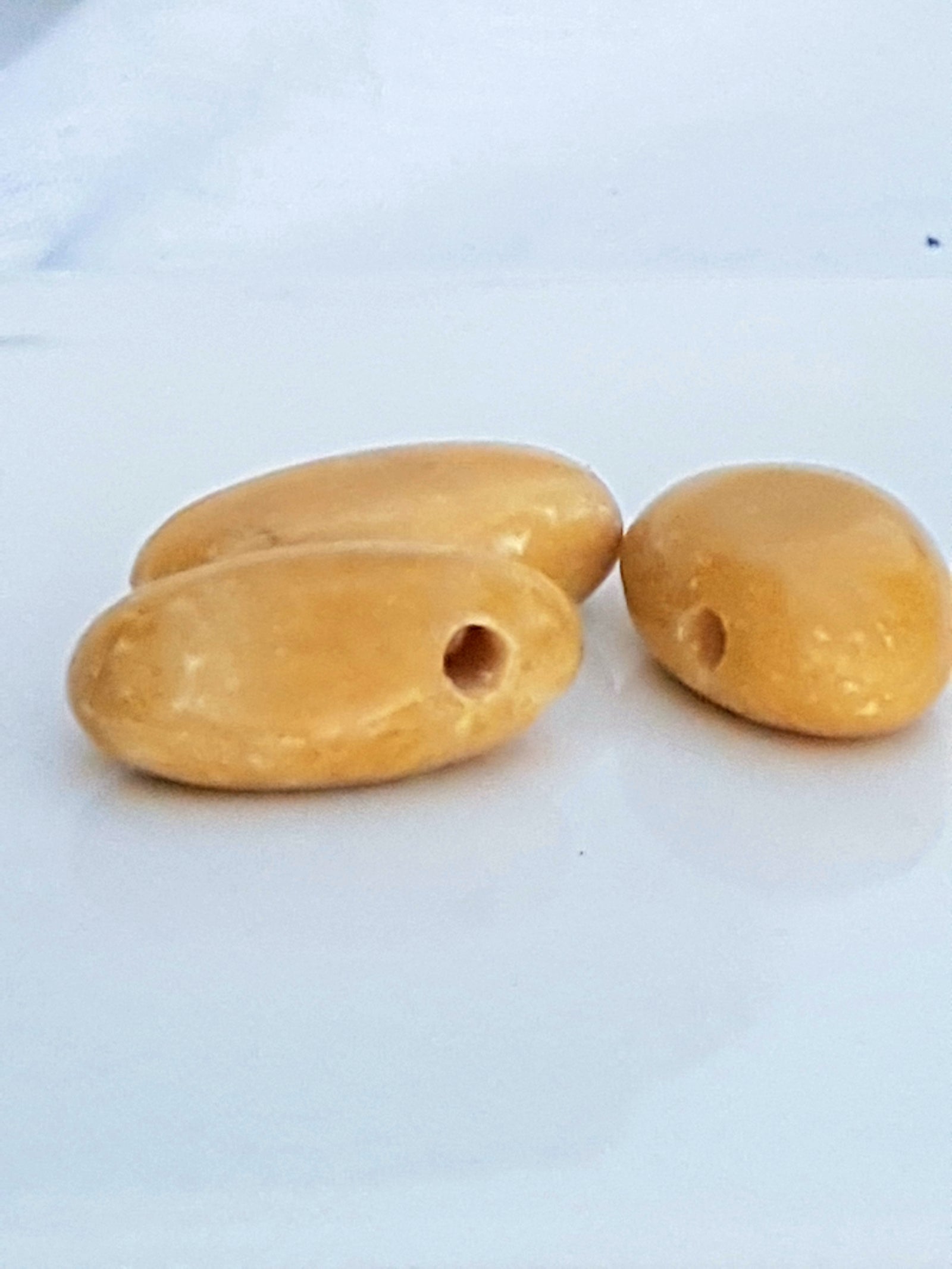 Yellow calcite drilled stone - The Science of Magic 