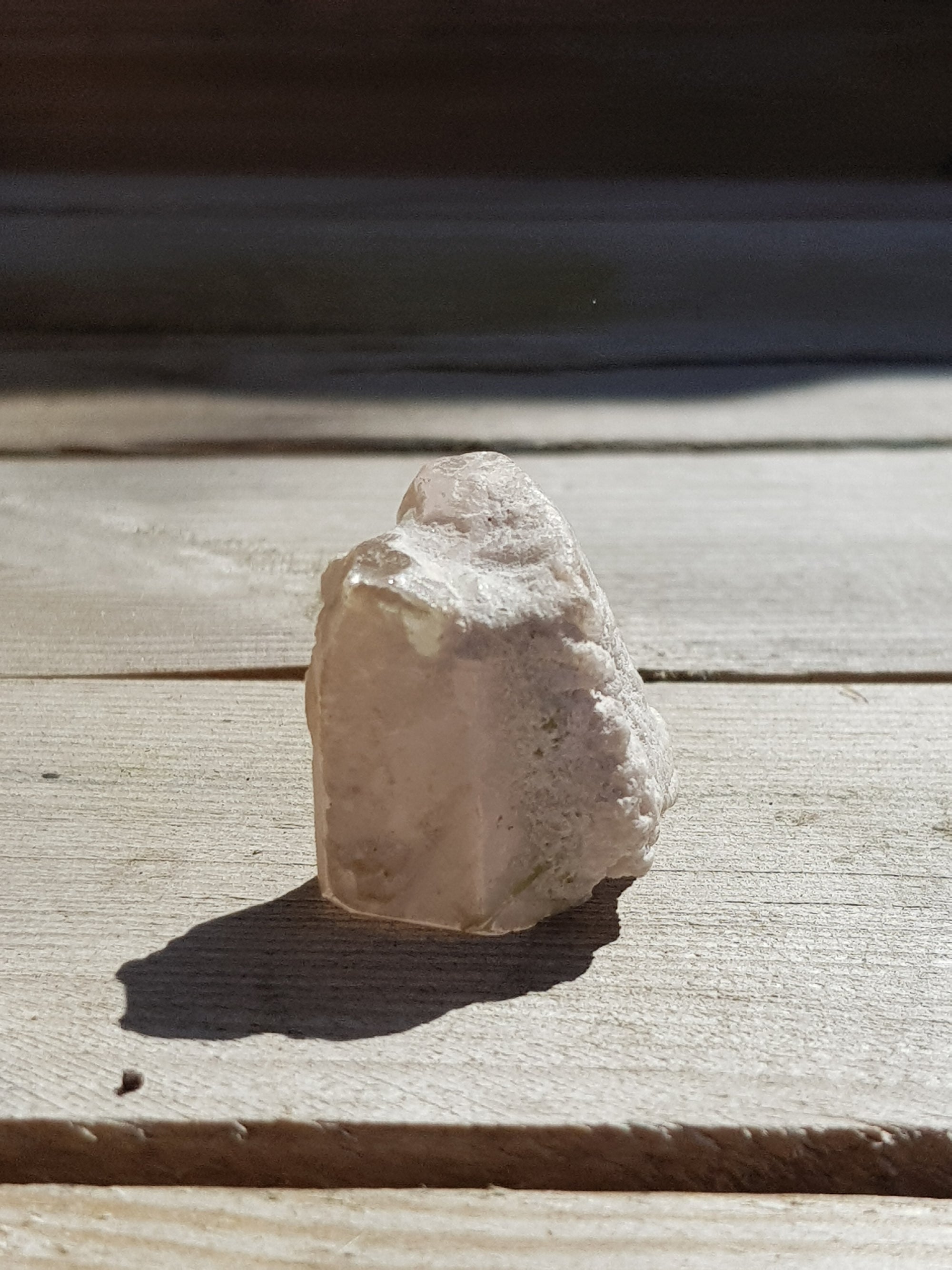 raw morganite crystal showing long crystallographic face