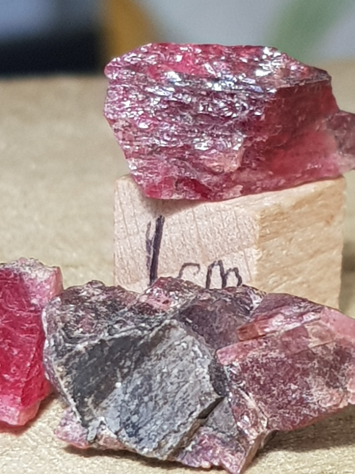 pyroxmangite chips. They are a vivid pink and very gemmy. They are about 1.25cm on the longest plane.