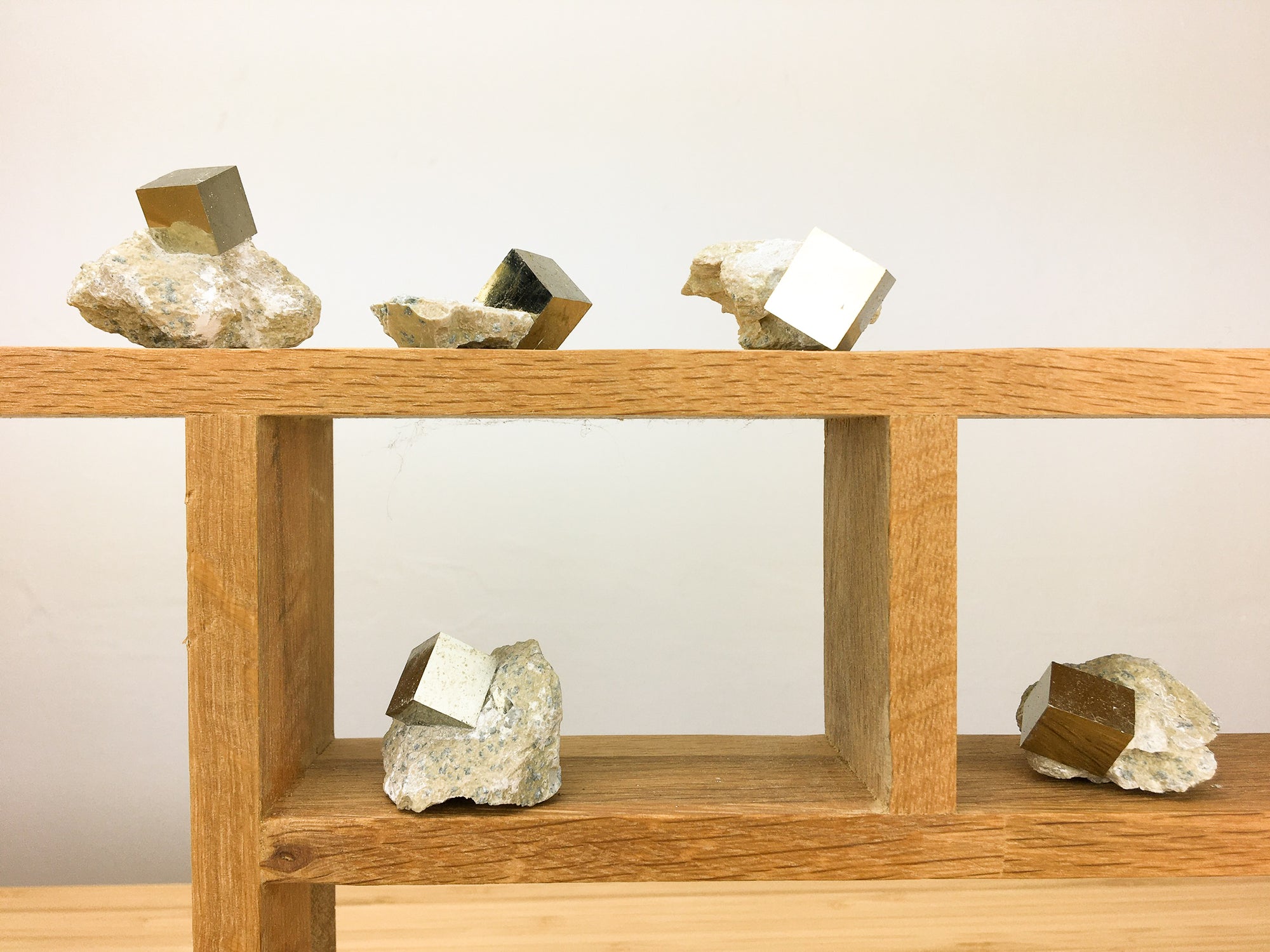 Naturally occurring iron pyrite cubic crystal in matrix