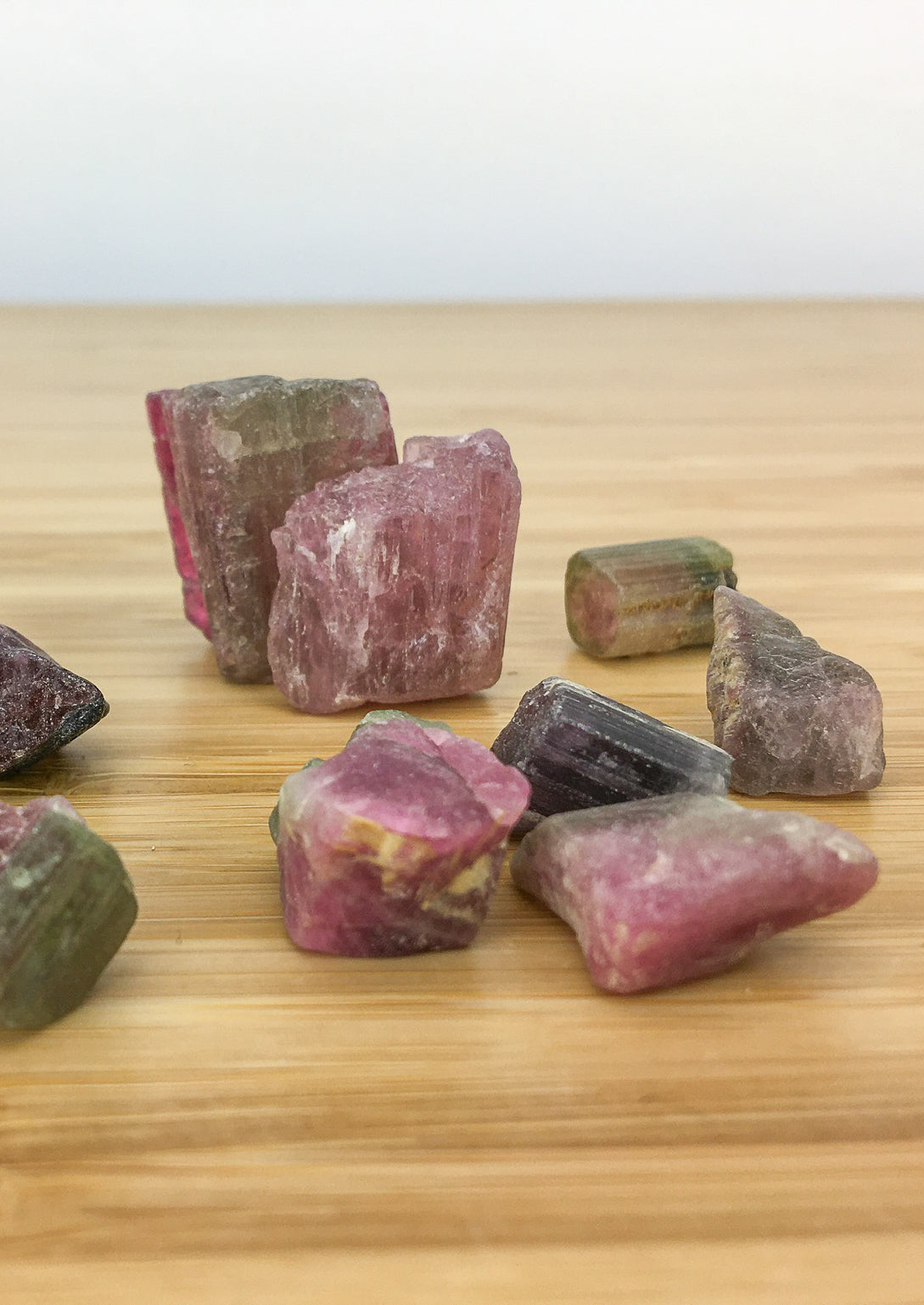 well formed elbaite (tourmaline) crystals. They are pink and green and show concentric zoning.