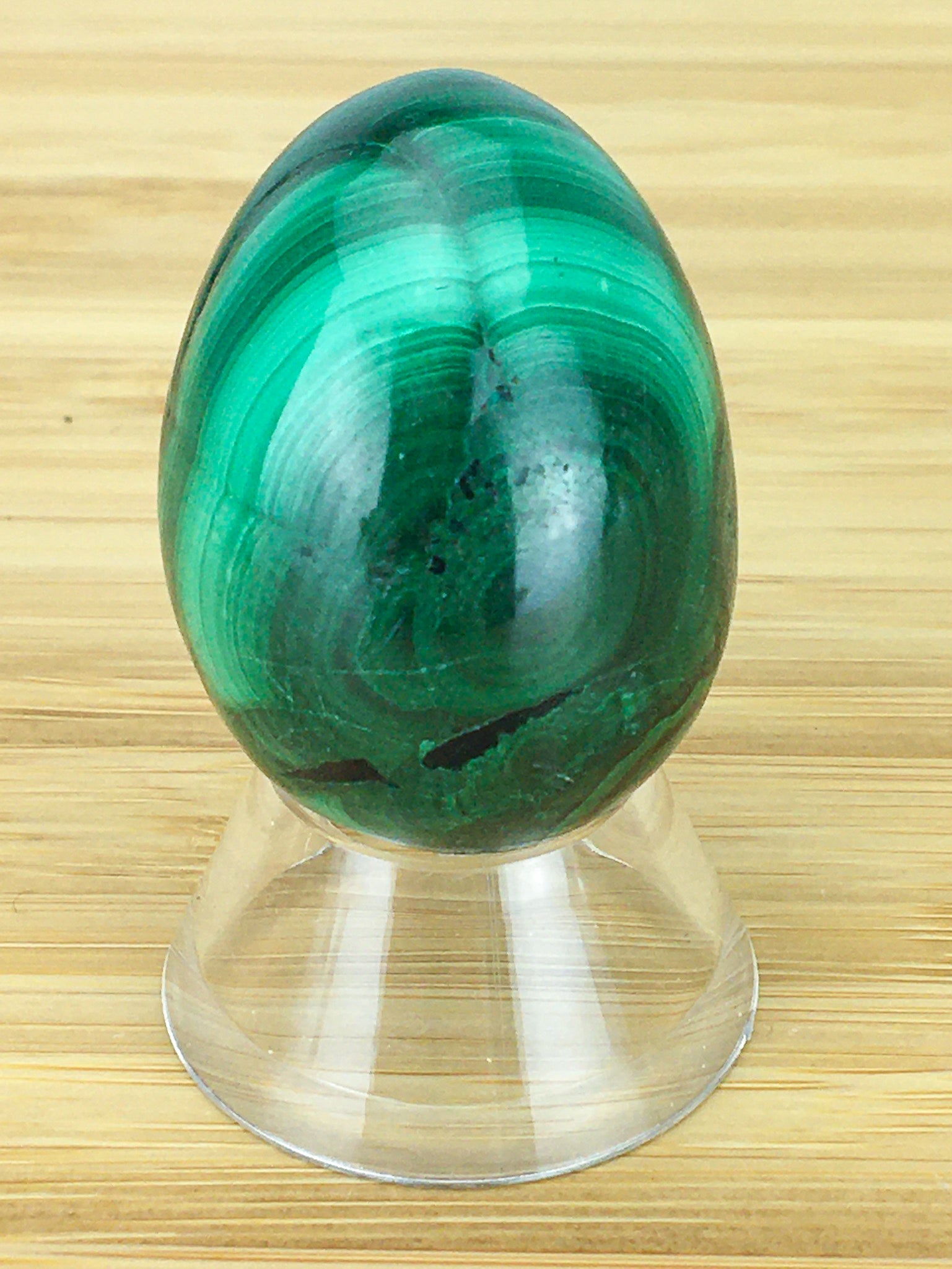 malachite egg on an egg stand