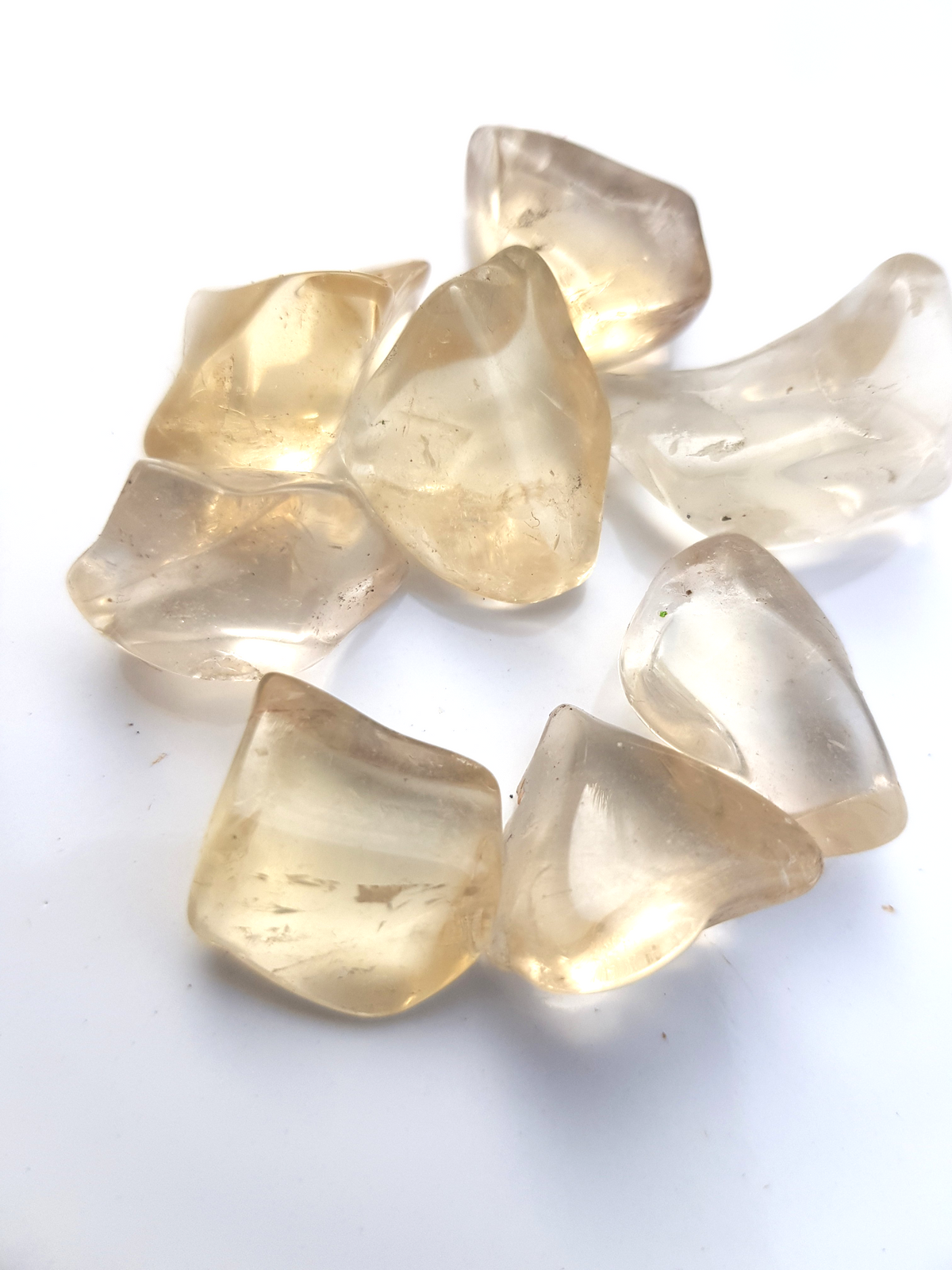 irregularly shaped small pieces of citrine. It is very translucent and a light lemon colour