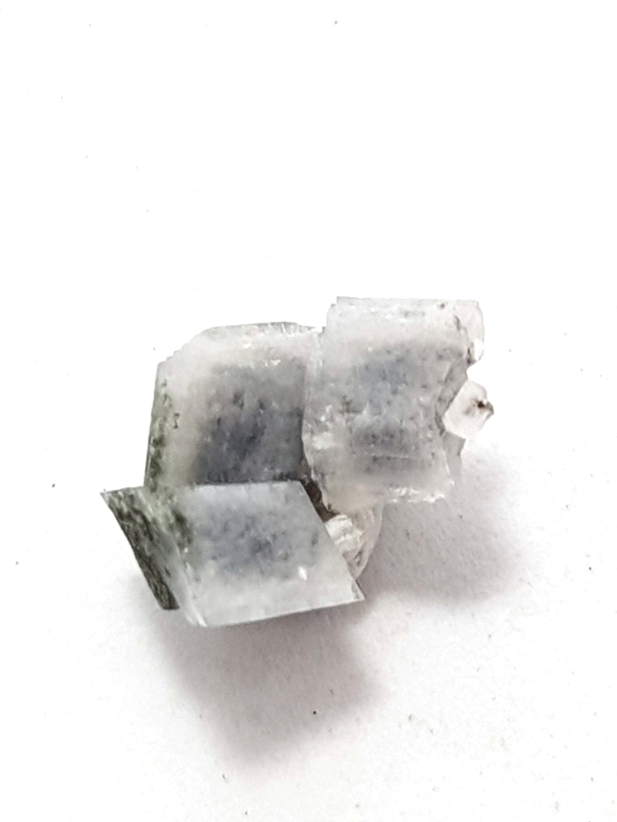 adularia crystals. There are three in a cluster. They are white. They are rhombic