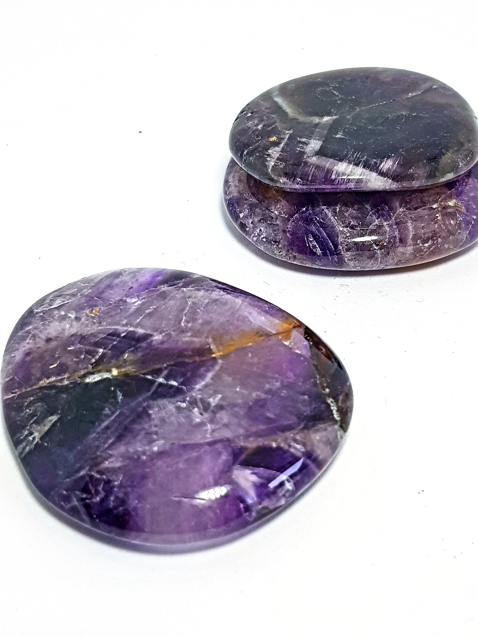 three amethyst palm stones.