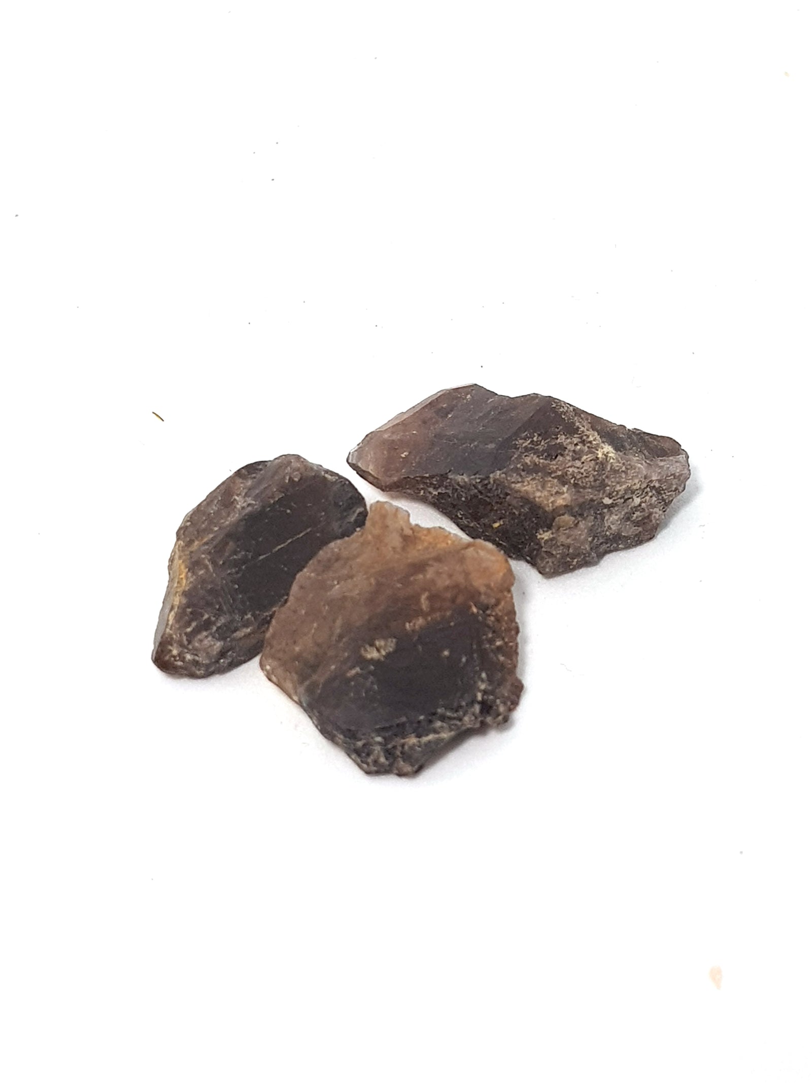 three bladed "axe-like" crystals of axinite. They are purple/brown