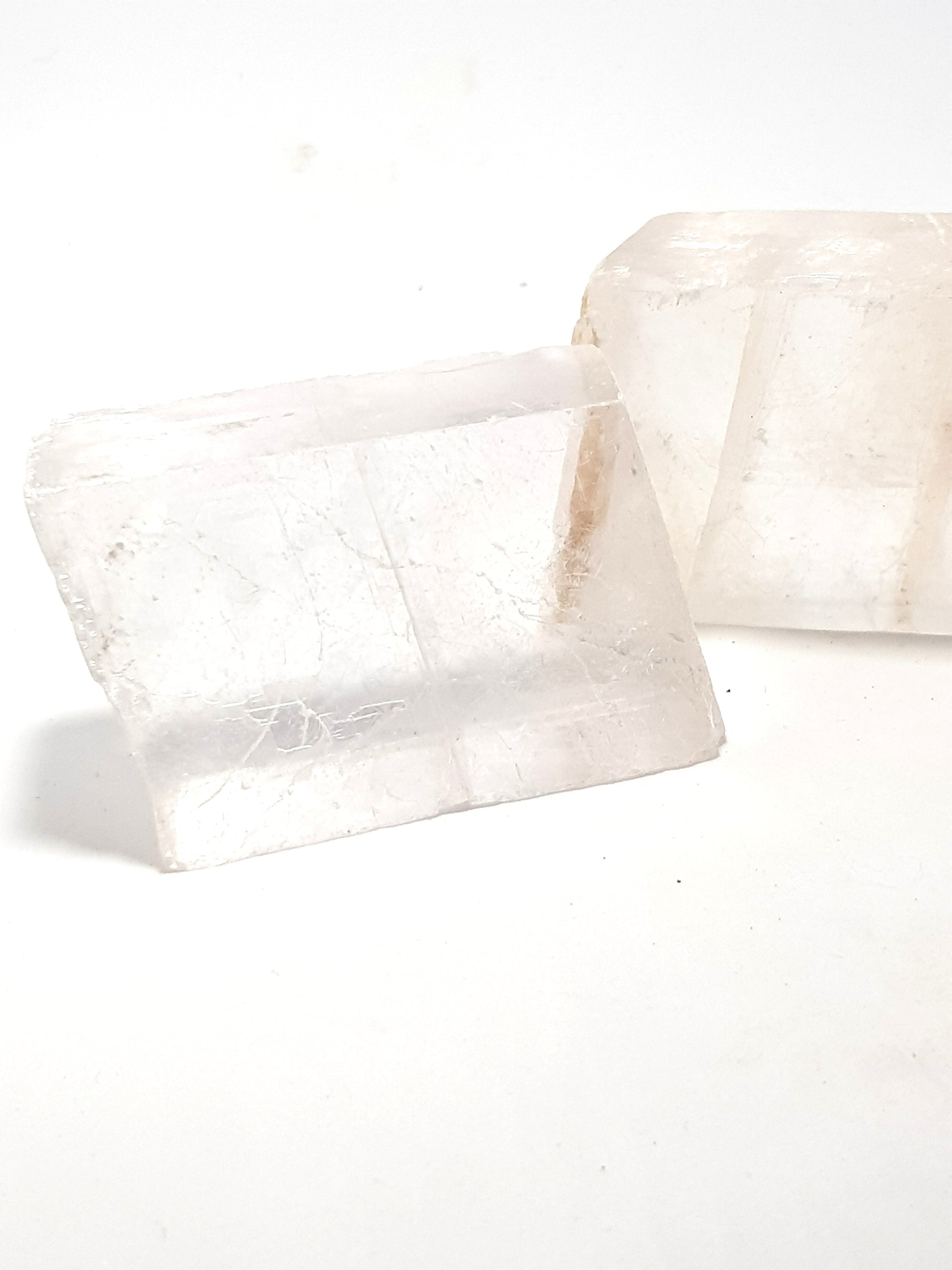 two calcite rhombohedrons. They are clear and very translucent