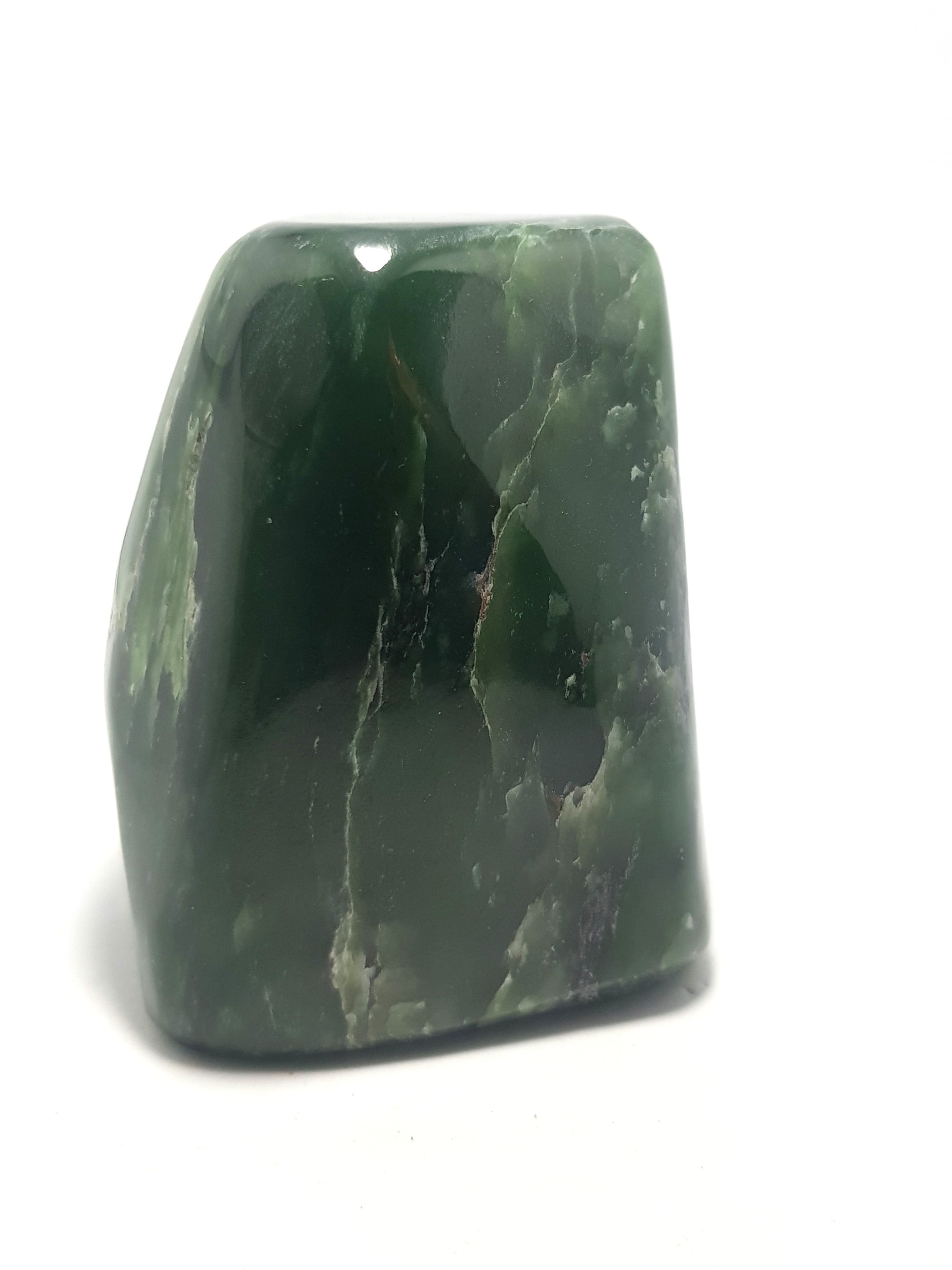 Nephrite jade freeform. Dark green with some white and green patches
