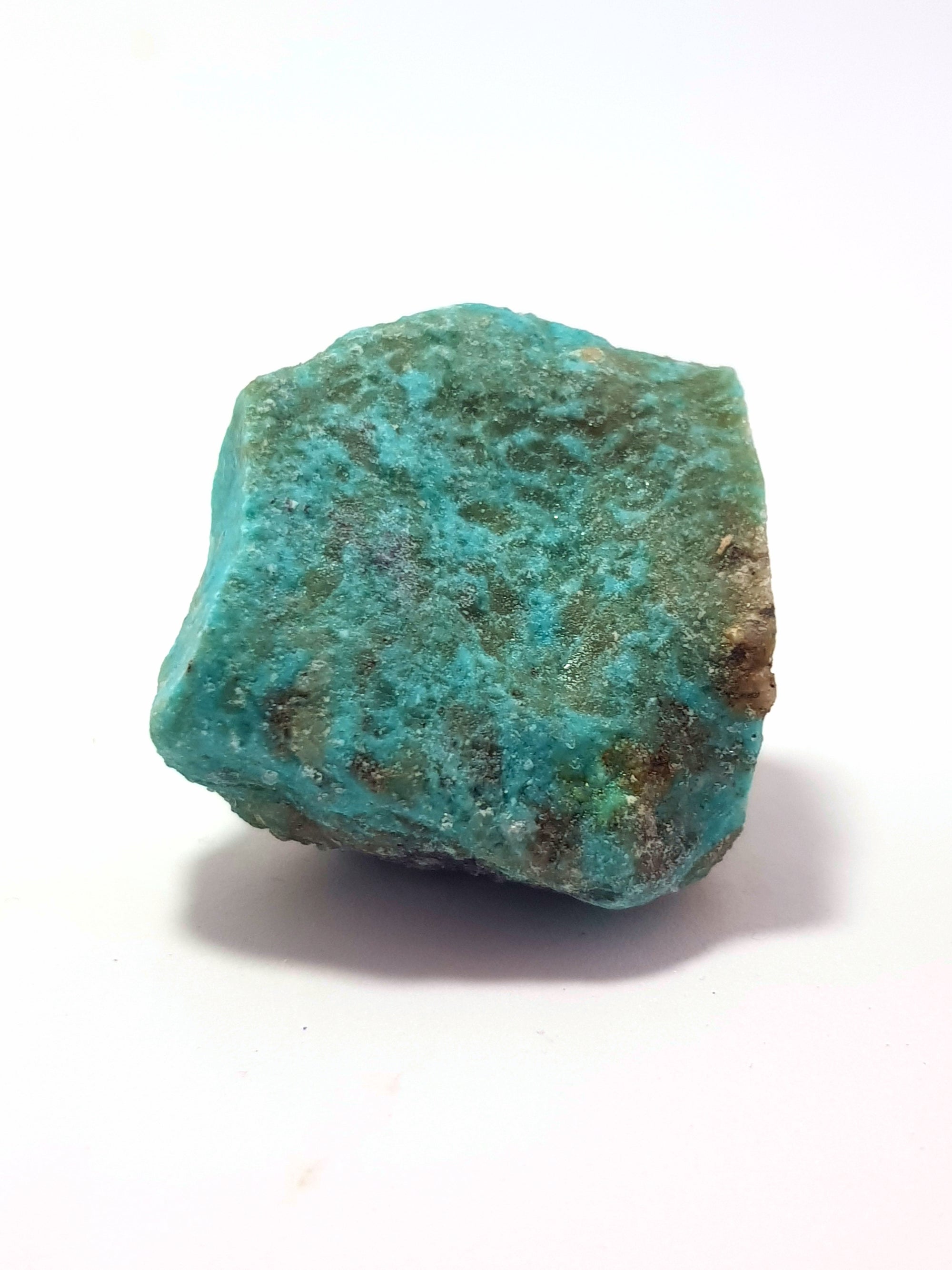 sample of raw kingman turquoise. this piece does not have a strong blue hue