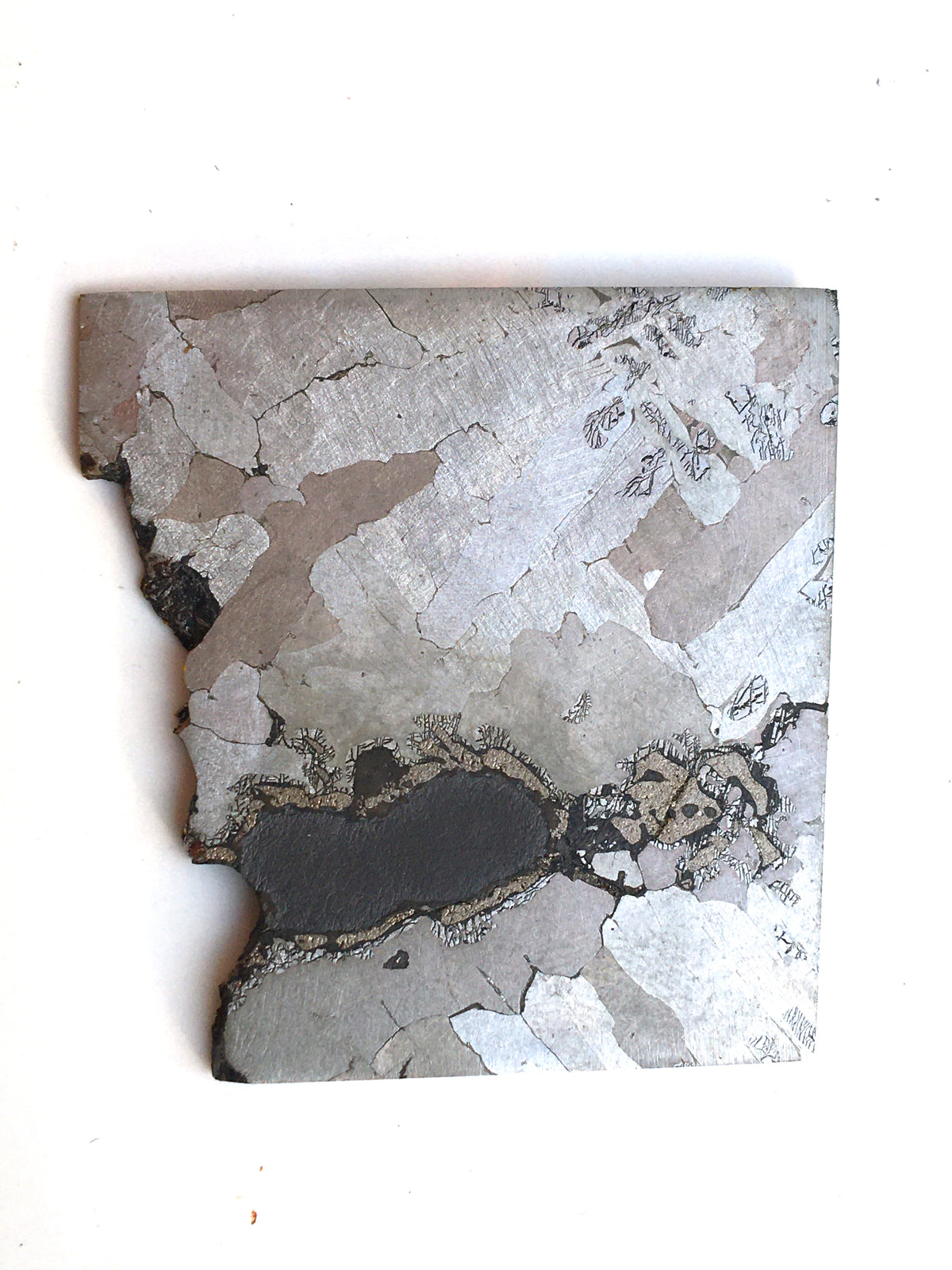 Acid etched sample of Nantan (iron nickel meteorite). Widdmanstatten pattern very visible.