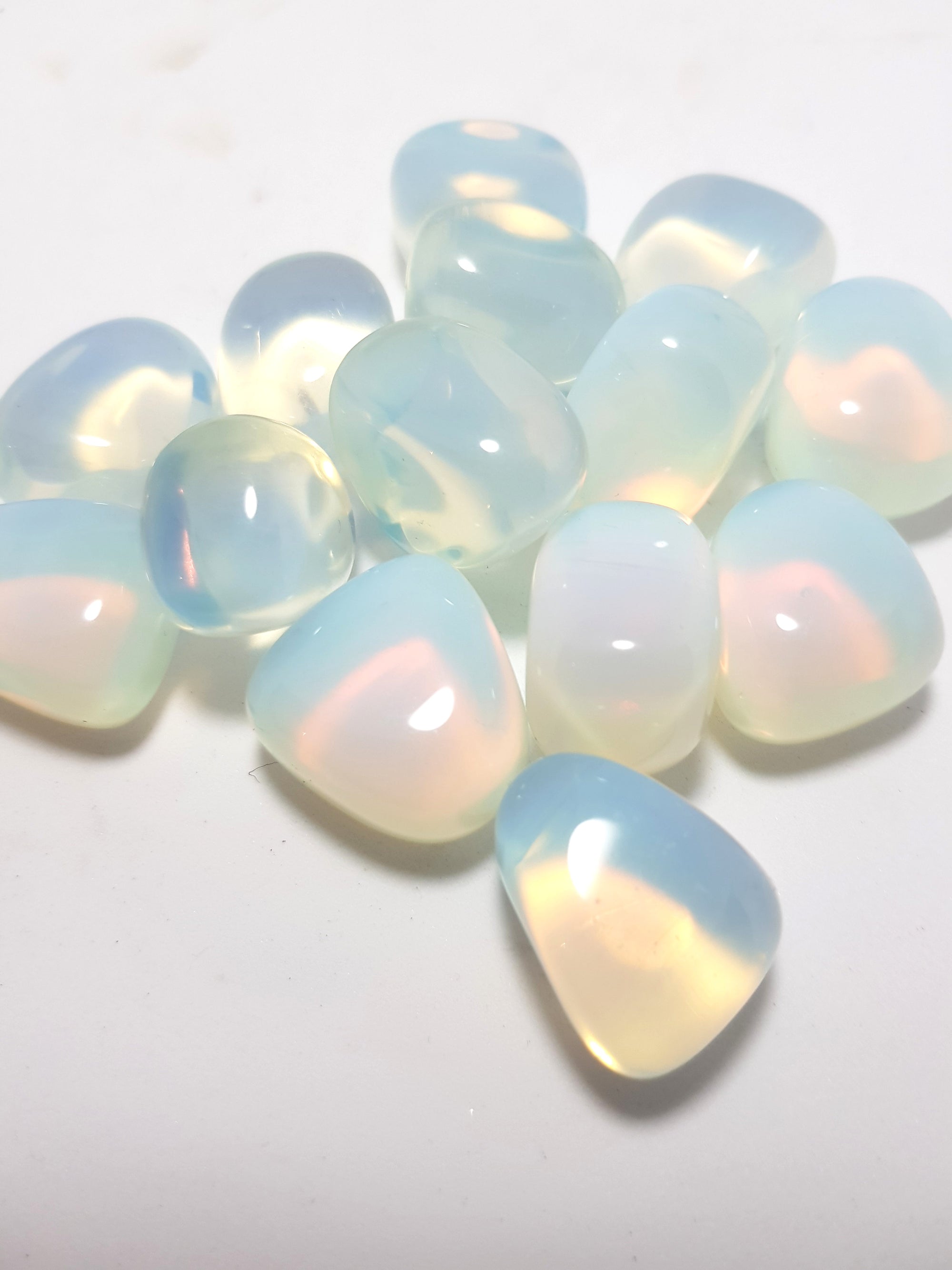 opalite tumbles with a glow of pink and blue