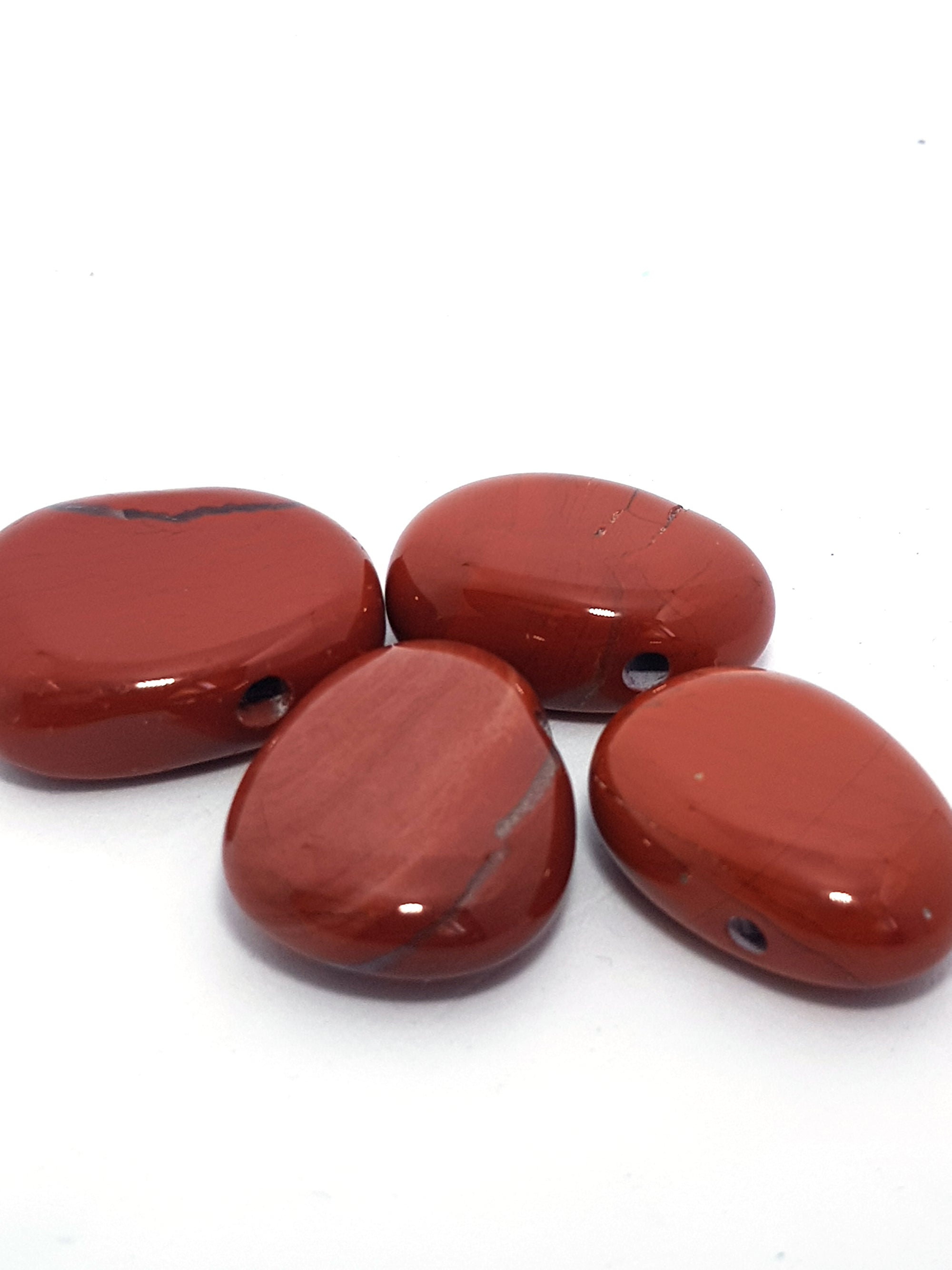 Red jasper drilled stone - The Science of Magic 