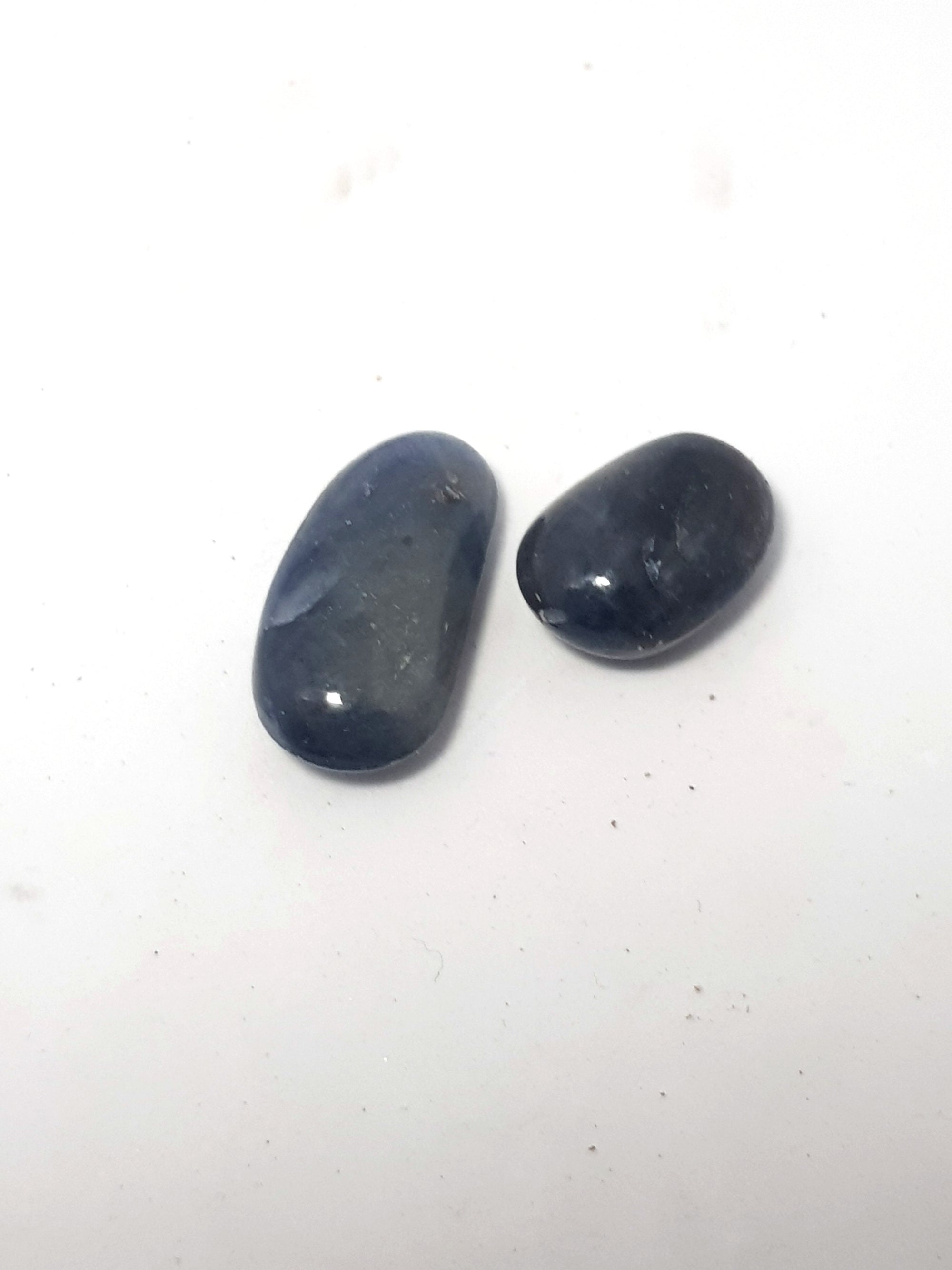 two small polished blue saphire. they are not gem grade and have no clarity