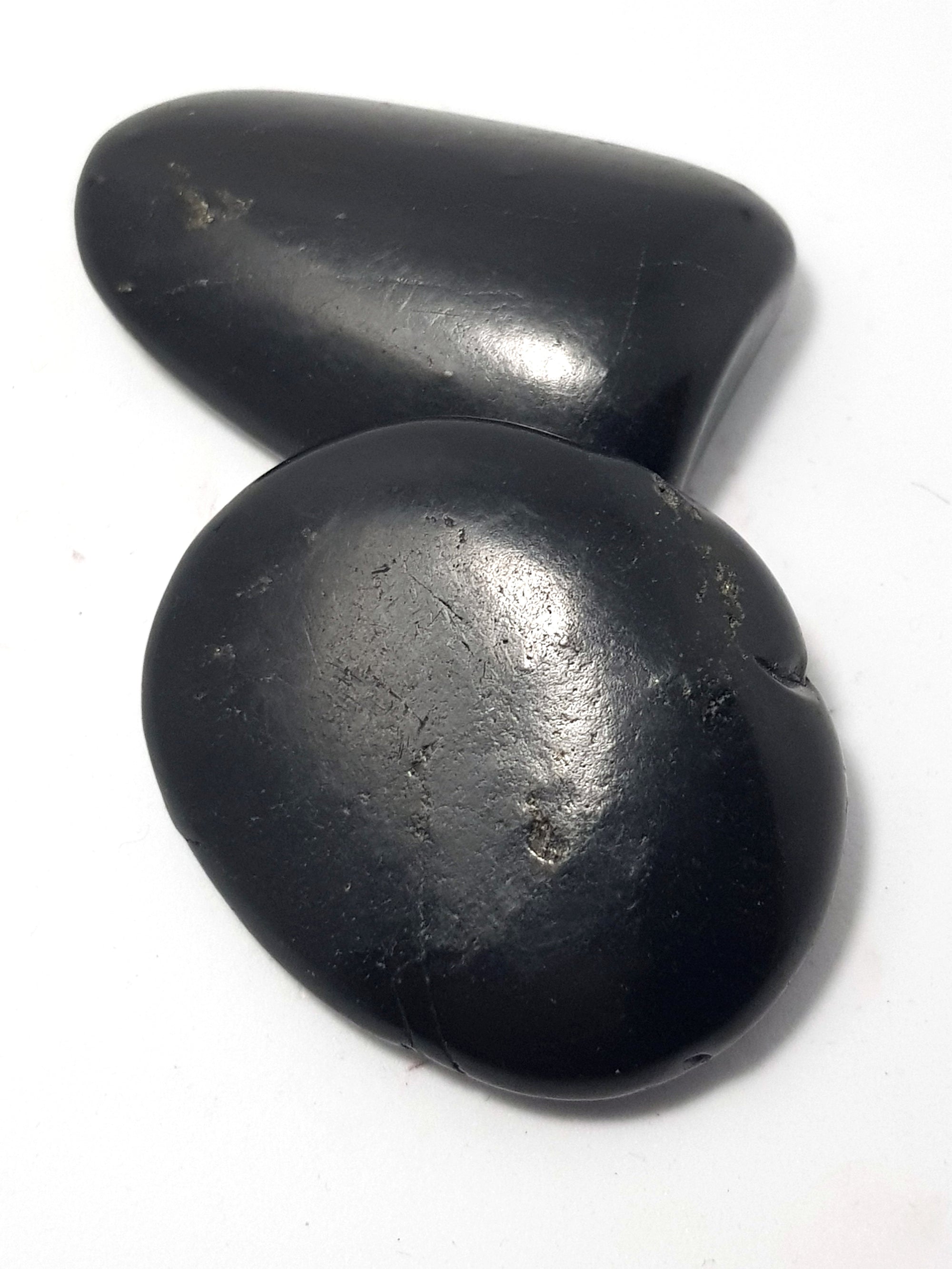 two polished pieces of shungite