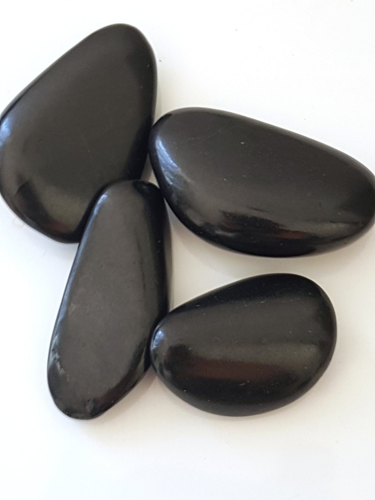 polished shungite pebbles. matte black