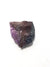 raw sugilite. this consists of a mauve mineral (sugilite) in a  dark grey and brown matrix